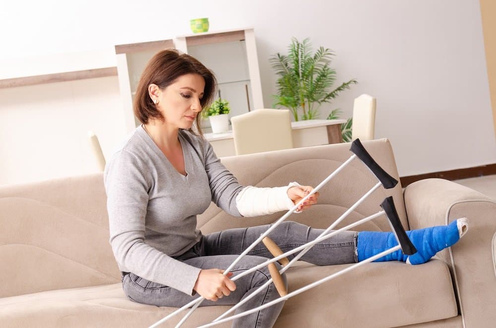 Injured woman feeling down at her house.