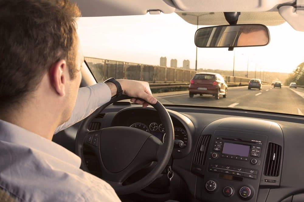 Businessman driving early in the morning.