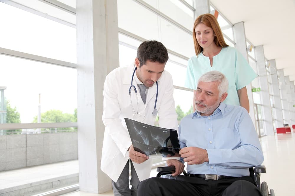 Injured man securing xray results of his injured leg as evidence for social security disability.