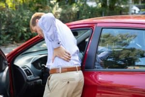 man with back pain from a car accident