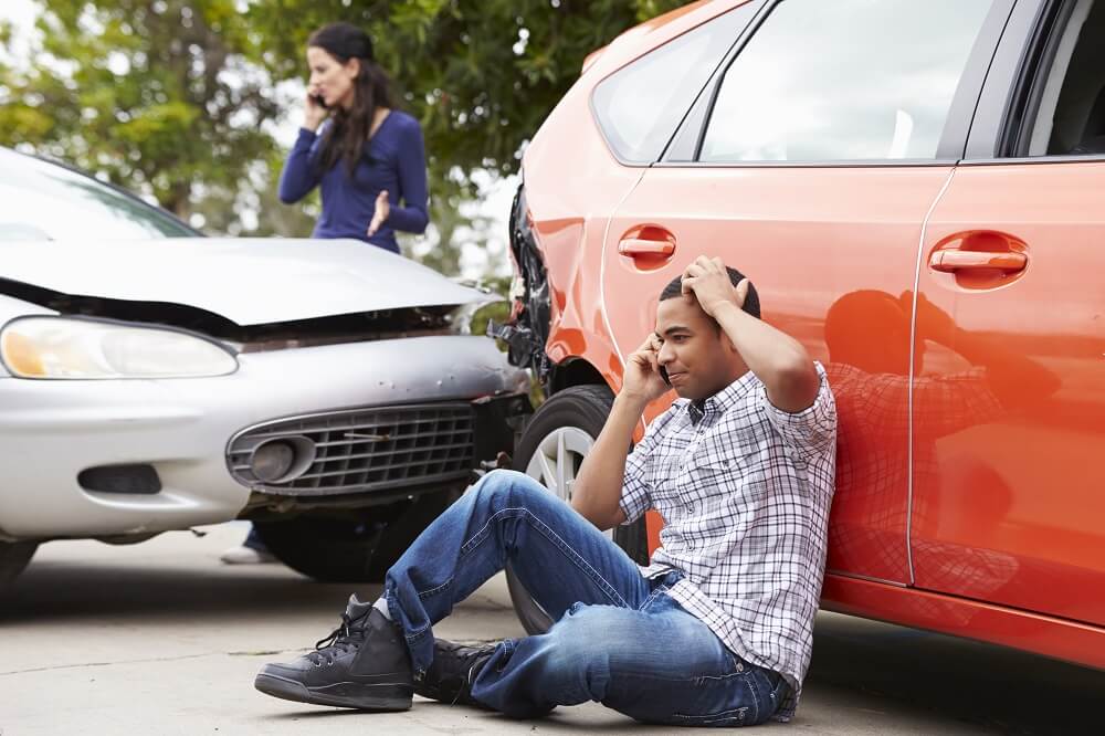 Driver calling police to report car accident.