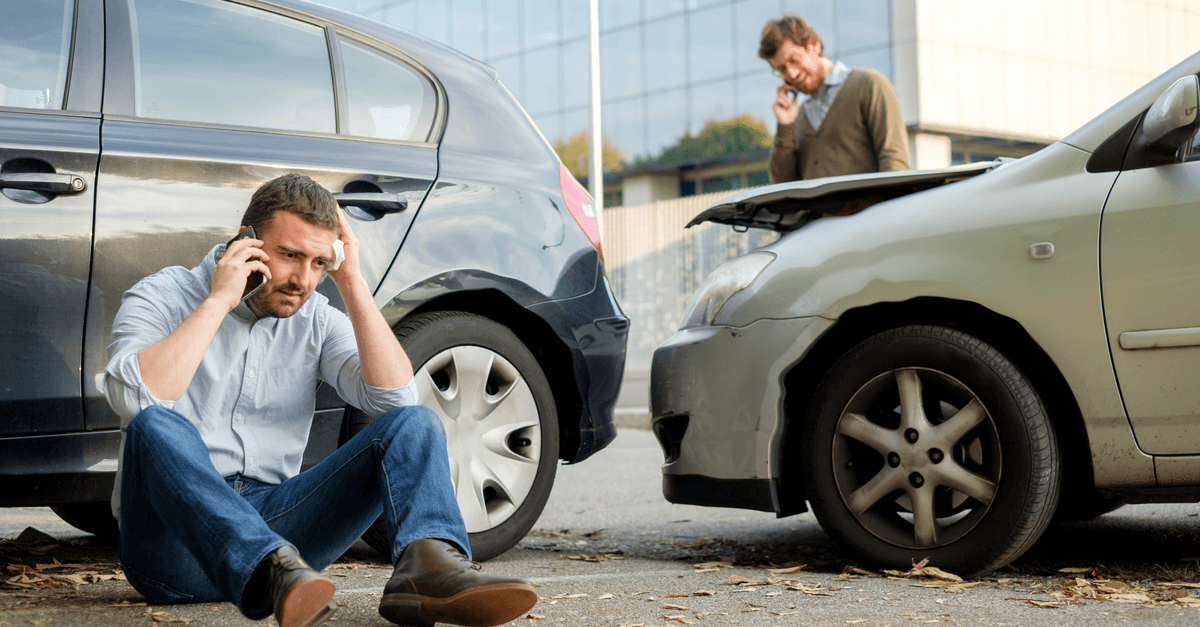 Driver calling police to report car accident.