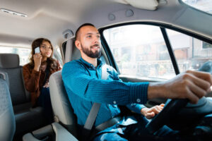 Ridesharing lyft uber driver with passenger