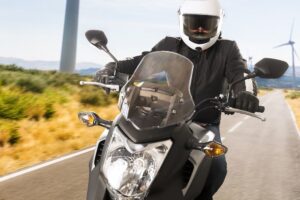 Motorcycle rider riding in the country side.