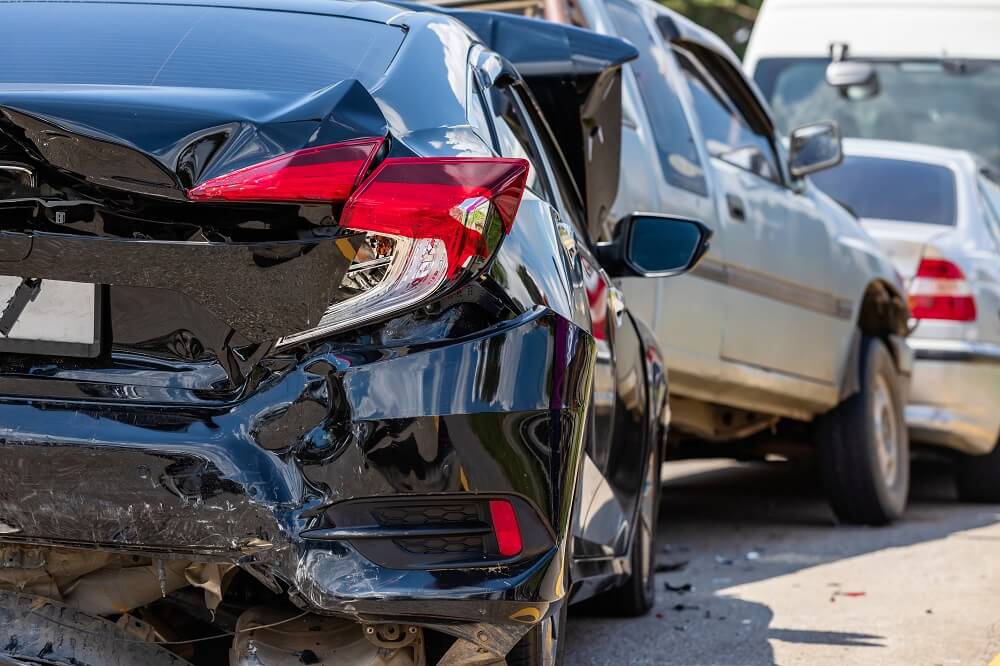 3-way car crash accident in the city highway.