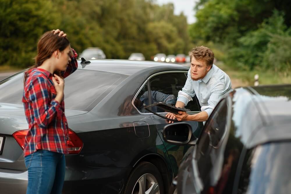 Drivers involved in accident arguing who's fault.