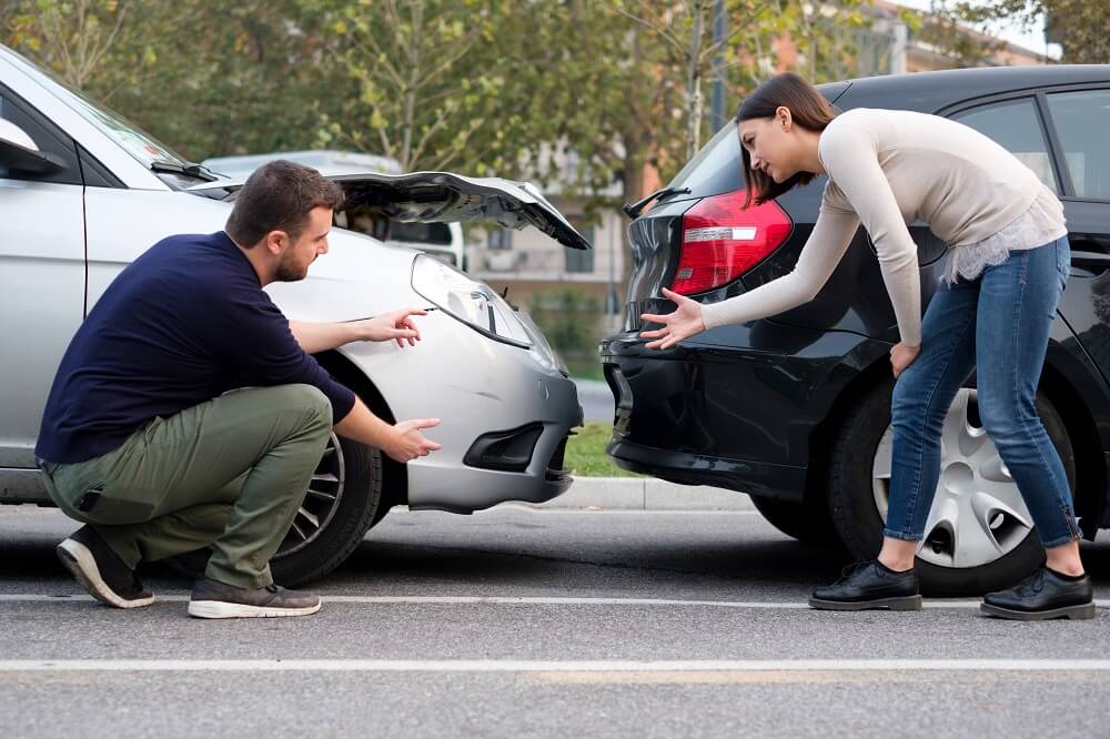 Drivers arguing who's fault on the rear-end highway collision