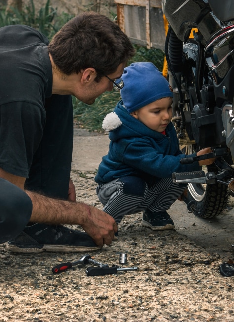 Image of a man preparing his motorcycle