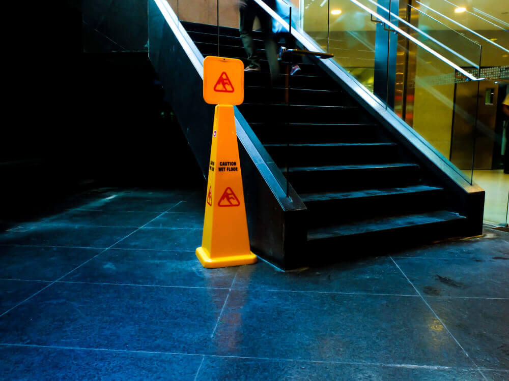 Caution wet sign under the staircase.